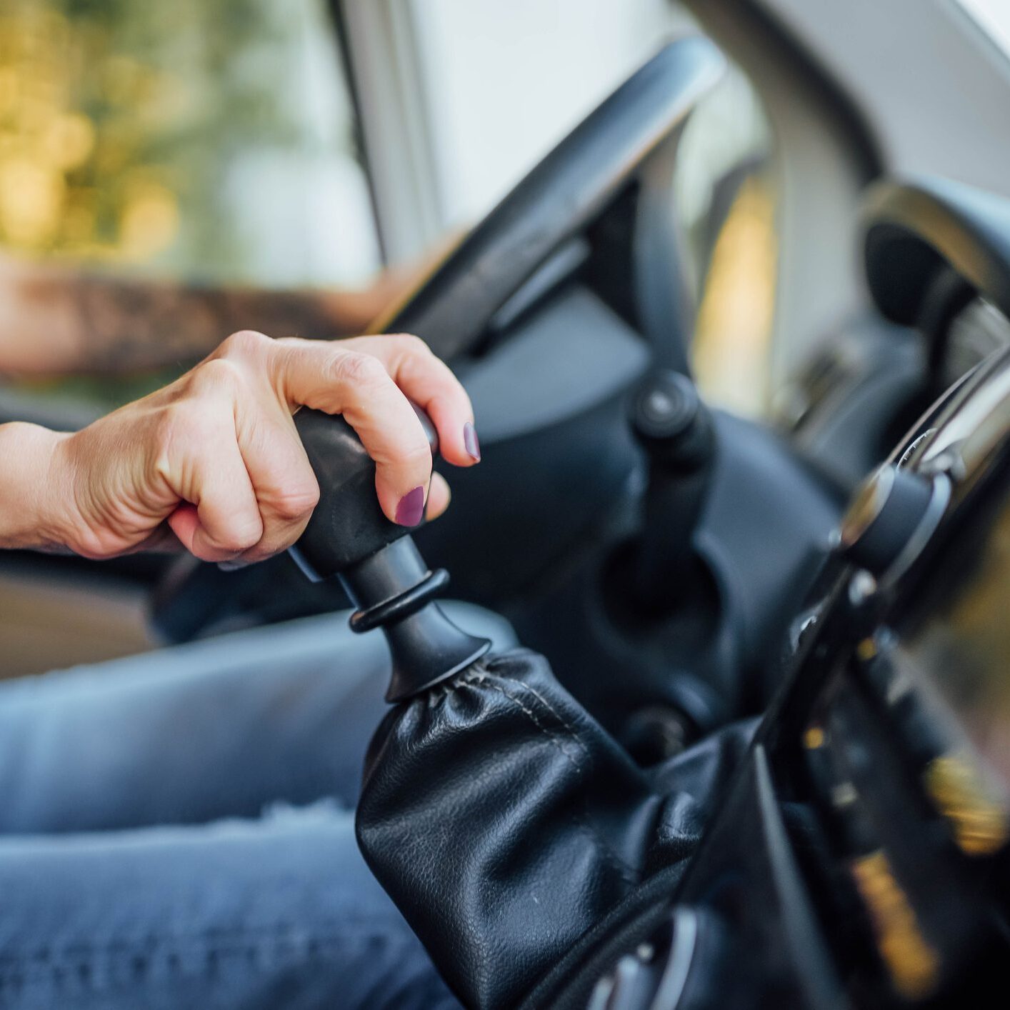 Driver hand on manual gear shift